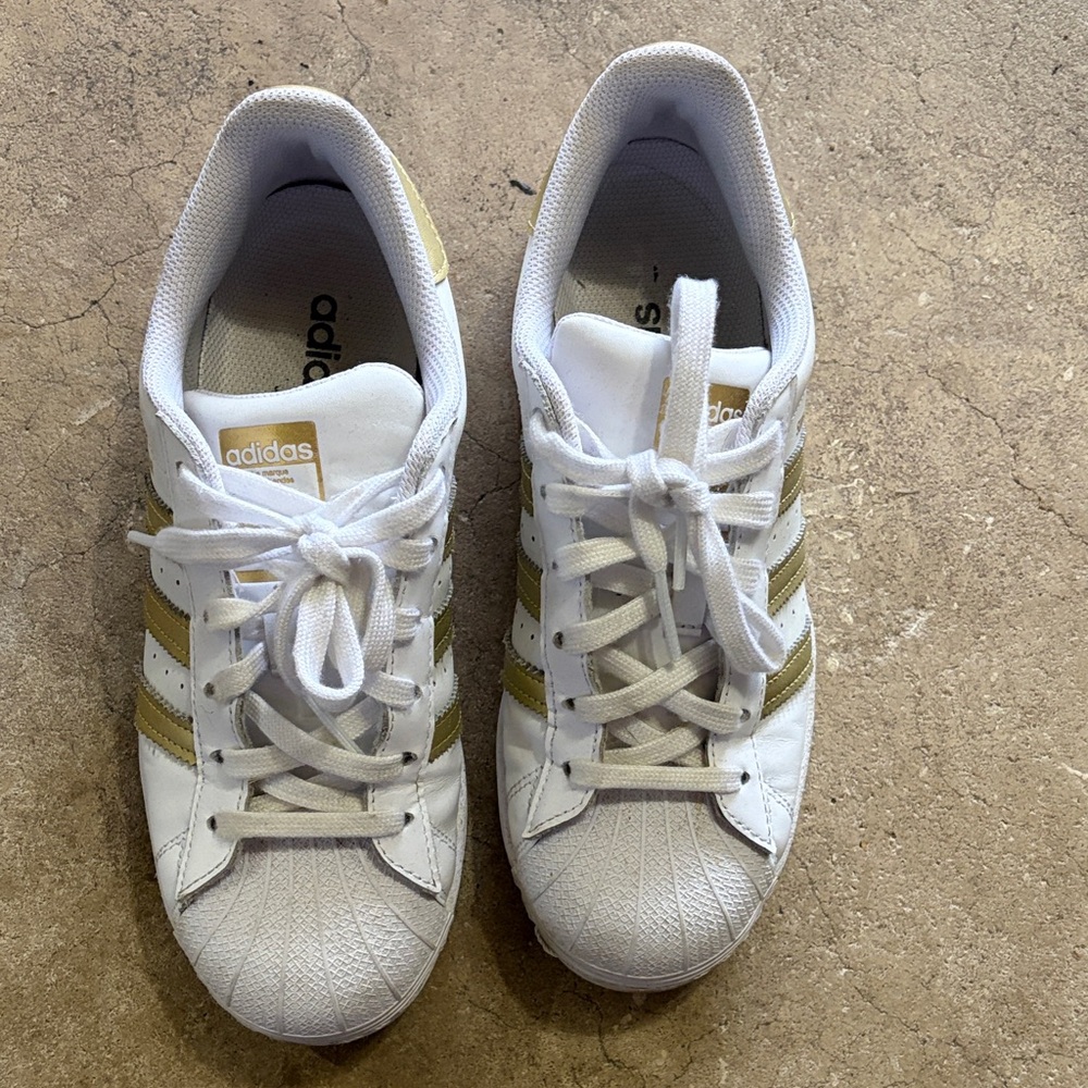 Adidas White Sneakers with Gold Stripes